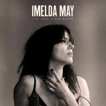 May pictured with a sepia-coloured tint, alongside the text "Imelda May" and "Life Love Flesh Blood" superimposed above