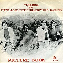 A black-and-white photograph of the four Kinks standing together in long grass. The sleeve is labelled "The Kinks Are the Village Green Preservation Society" above and "Picture Book" below.