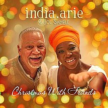 An image of India.Arie and Joe Sample looking towards the camera while surrounding by little lights. The album title and the artists' name are around them.