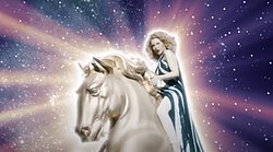 A part of the song's music video in which Minogue is sat on a golden horse sculpture, in front of a starry background.
