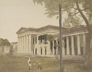 A coloured-in photograph (1851) of Hindu College, Calcutta, which had been founded in 1817 by a committee headed by Raja Ram Mohun Roy. In 1855, the Government of the Bengal Presidency renamed it Presidency College and opened it to all students.