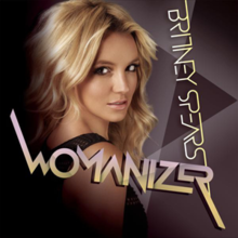 Upper bust of Britney Spears. She looks into the camera over her right shoulder. She is wearing a black top with small holes. The background is composed by geometric figures in different shades of purple. The text "Britney Spears" and "Womanizer" are angled across the image in stylized print.