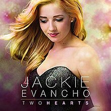 Two Hearts album cover photo showing Evancho in black dress with colored clouds behind.