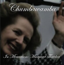 Cover art of Chumbawamba's EP "In Memoriam: Margaret Thatcher", featuring the title and band name in a script typeface over a picture of Margaret Thatcher smiling and waving