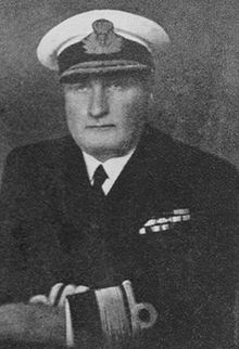 Black-and-white photograph of a man in naval uniform