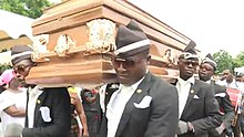 Screenshot of the video clip showing pallbearers dancing with the casket, which is originally taken from BBC News