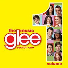 Photographs of ten people on a multicoloured background fill in a large Arabic numeral "1" to the right. On a yellow background, the word "Glee" is in lowercase white to the centre left, with the words "The Music" above and "Season One" below in lowercase red font. The word "Volume" also appears beside the 1.