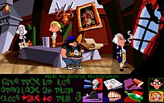A horizontal rectangular video game screenshot that is a digital representation of the domestic room. Four characters stand around a table in the middle of the room. A list of words and icons are below the scene.