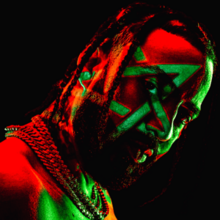 A photograph of French Montana with dreads, with green and red lights on his face and a pentagram around his left eye