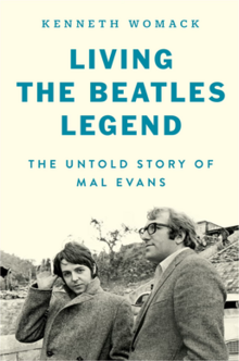 The text "Kenneth Womack Living the Beatles Legend: The Untold Story of Mal Evans" above picture of Mal Evans and Paul McCartney