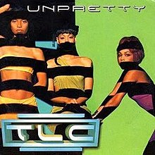 The three members are standing in front of a multi-colored wall, with thick black horizontal lines covering their bodies. The song title is positioned above them, while the group logo is positioned underneath.