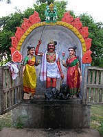 Ayyanar, a guardian kuladevata, accompanied by two consorts